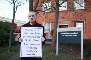 Preacher fined over Bible verse display challenges abortion clinic buffer zones Preacher fined over Bible verse display challenges abortion clinic buffer zones